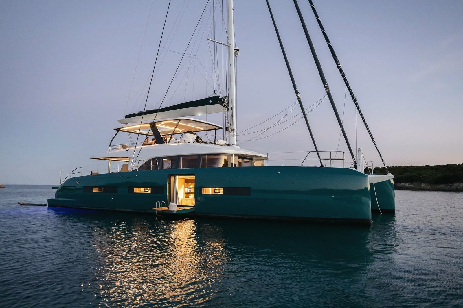Catamaran at anchor at dusk