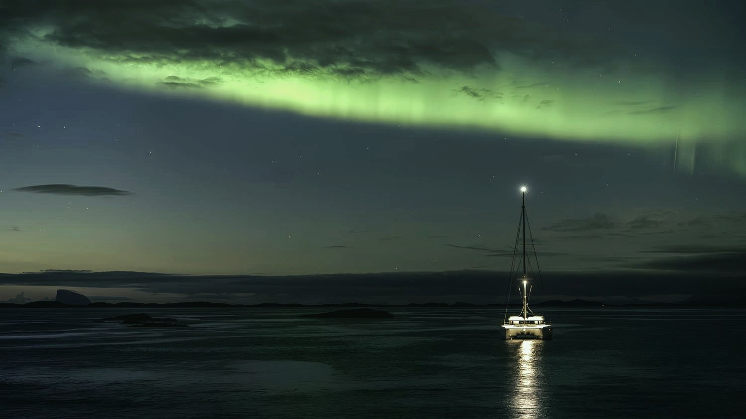Sailboat beneath the aurora borealis